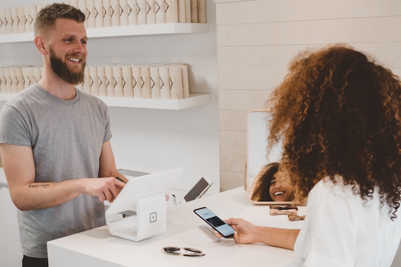 Customer checking out with a card during a sale